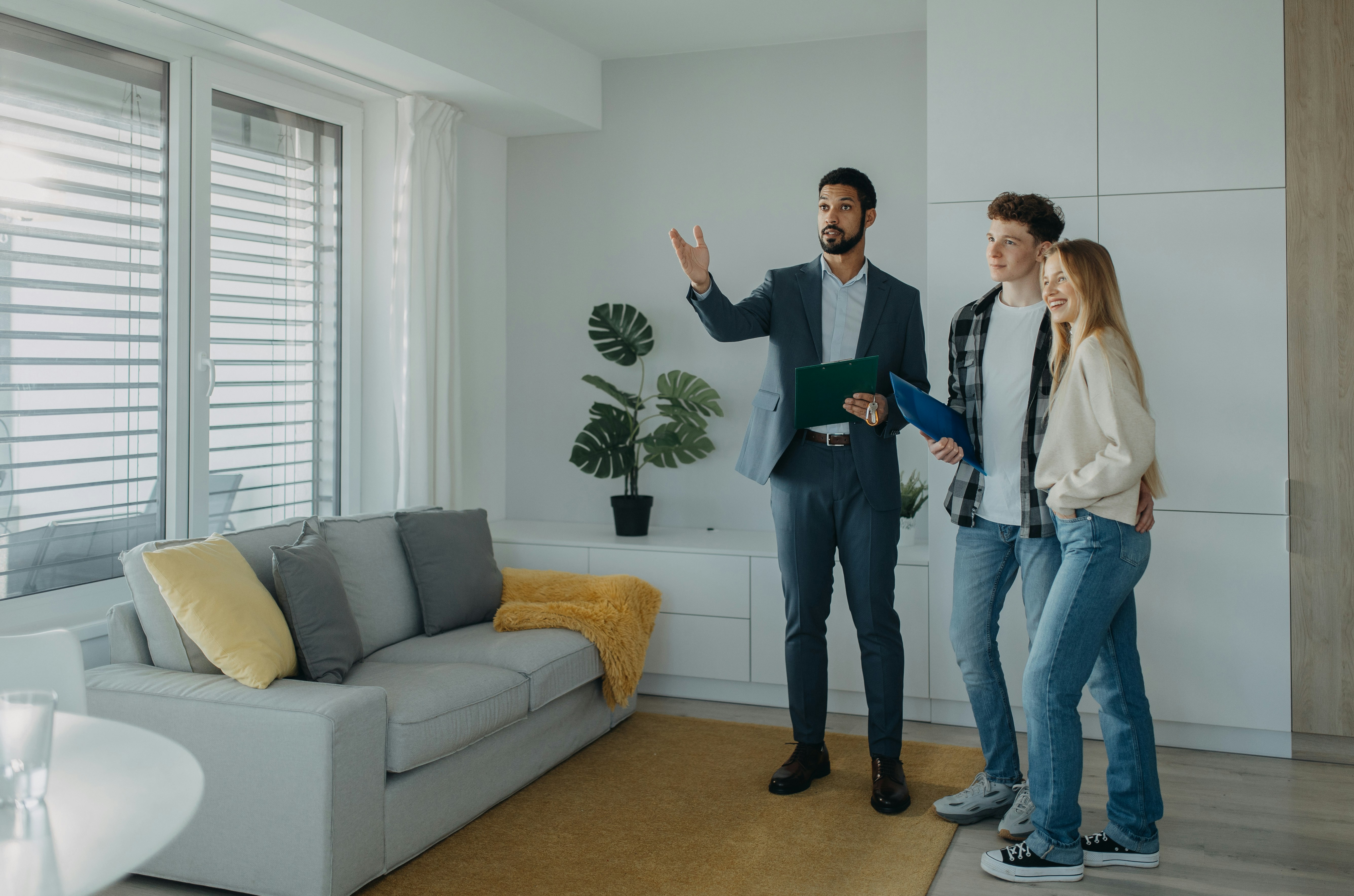 Realtor and couple in home