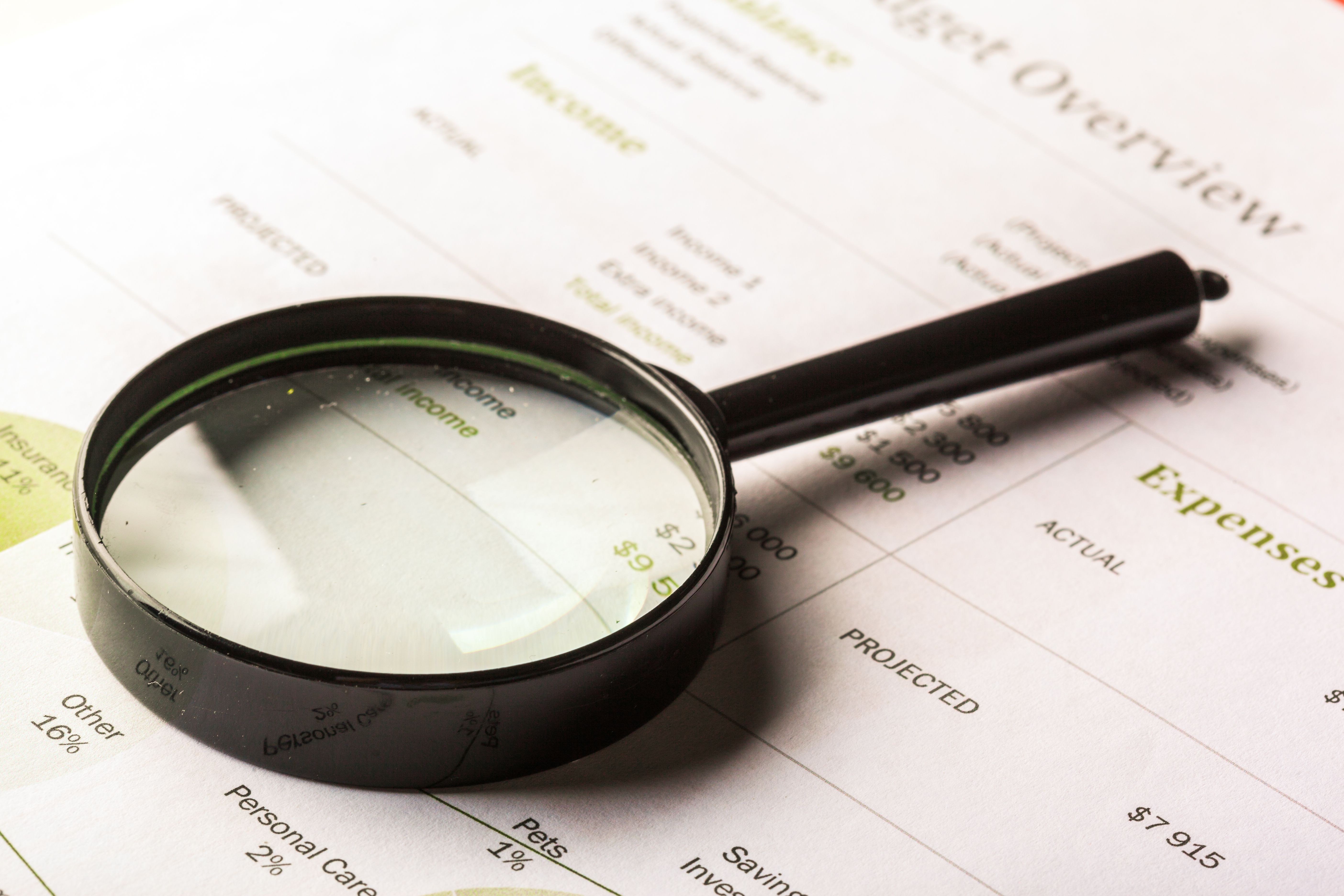 Magnifying glass laying on document
